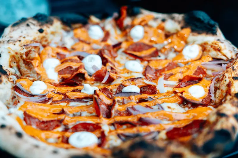 Tantalizing close-up of a cheesy pepperoni pizza with vibrant toppings and crust